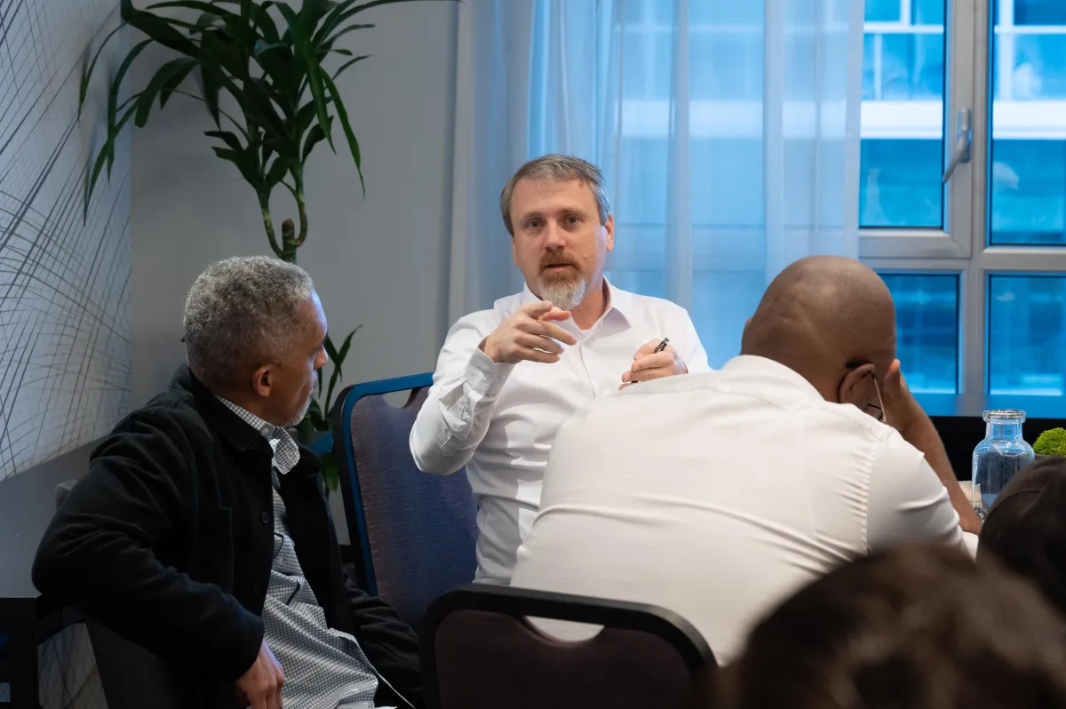 Fondako team members in discussion during the event